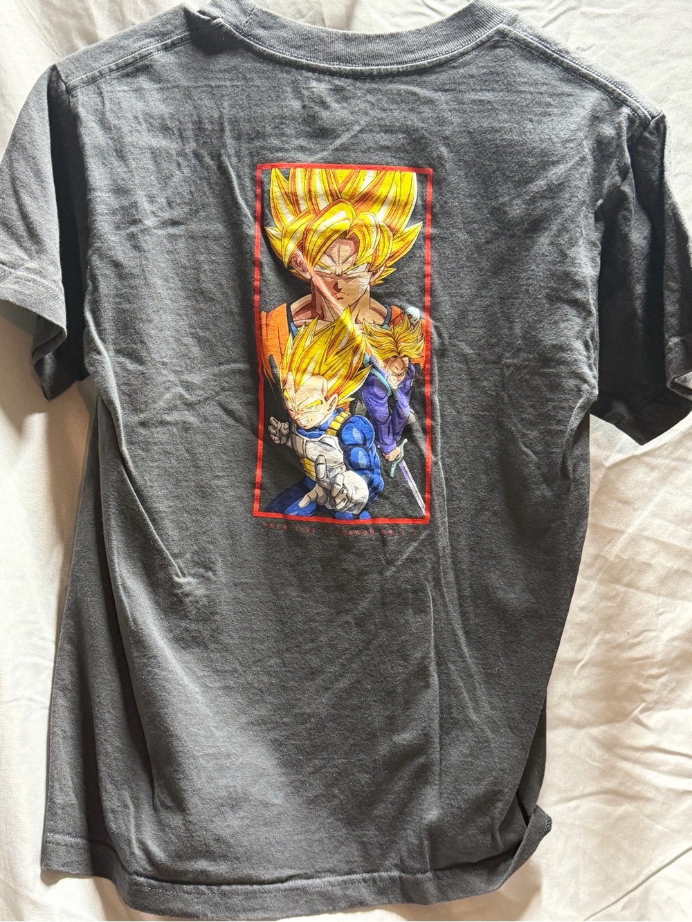 Primitive Charcoal Graphic Tee with Yellow and Blue Dragon Heroes